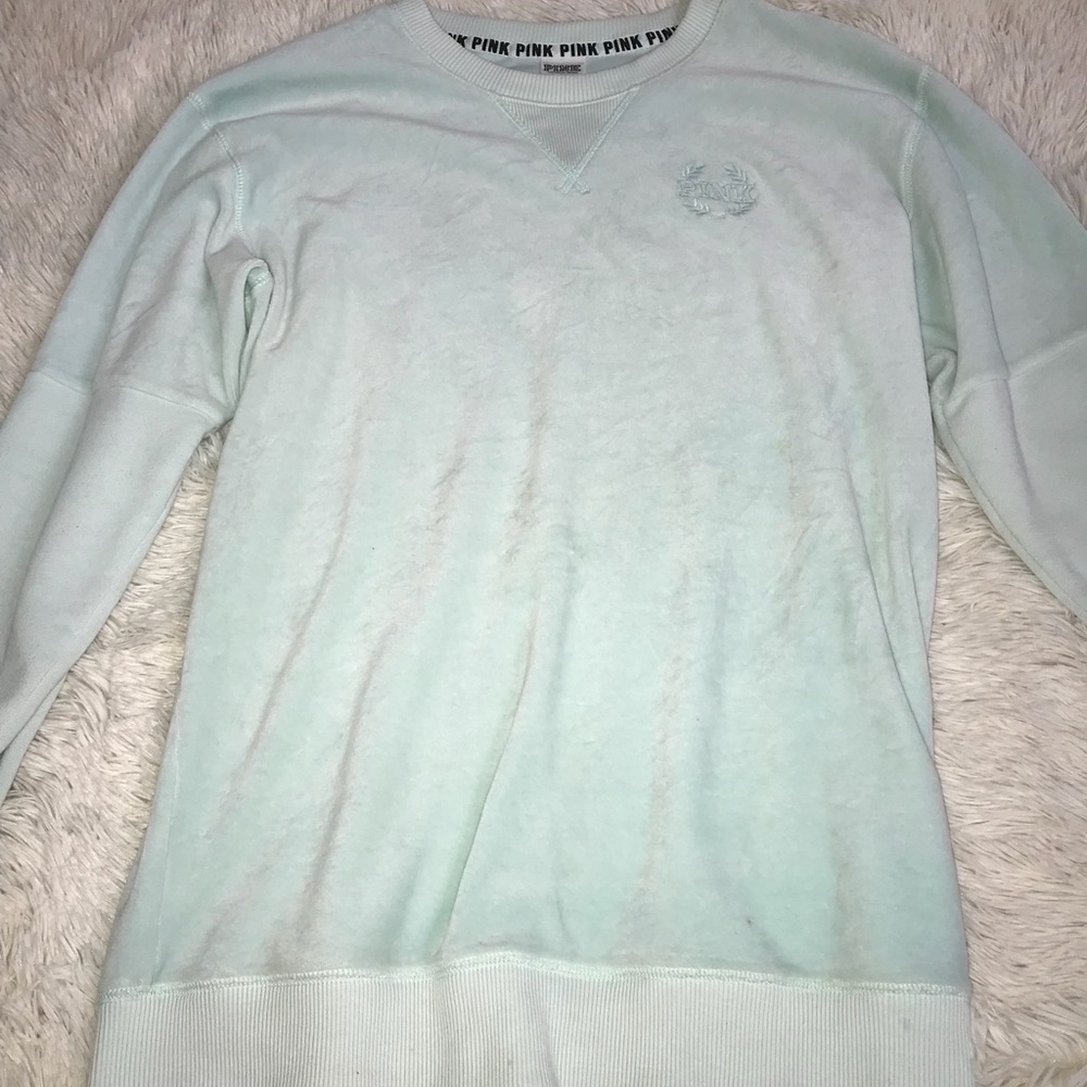 A turquoise sweatshirt from pink